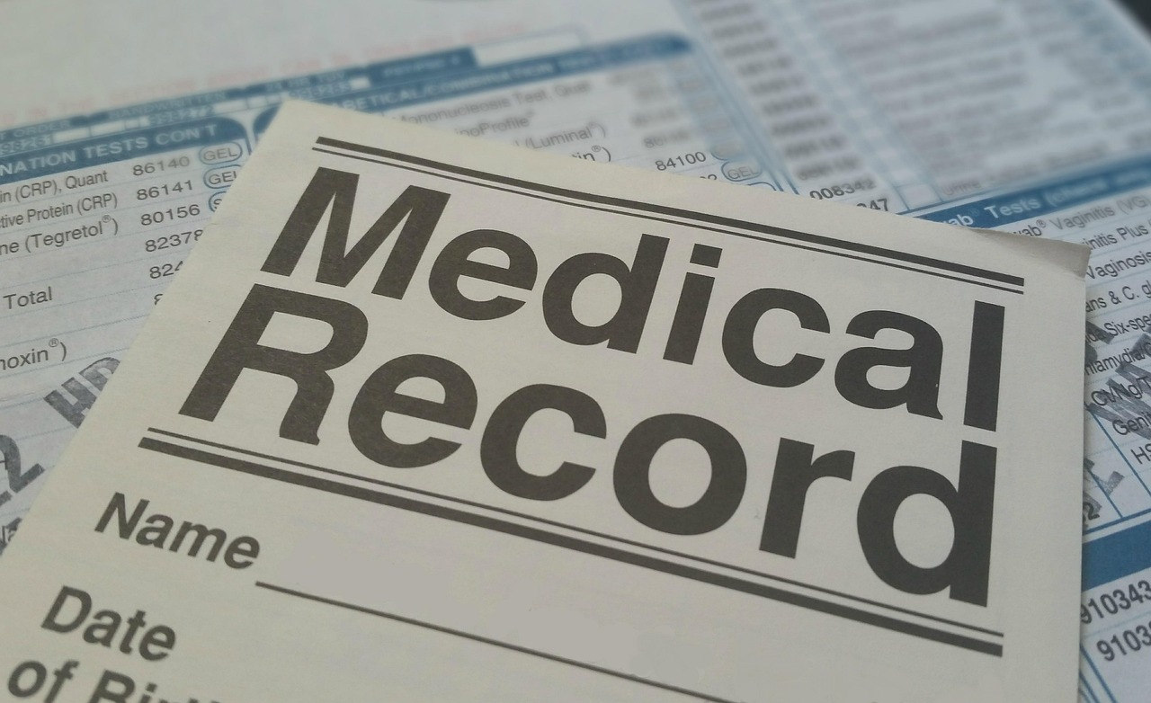 Doctor accessing patient reports on tablet